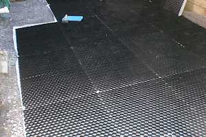 The CORE grid foundation is assembled, cut to shape to match the patio driveway requirements.