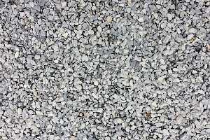 Gravel is spread evenly, ideally just covering the top of the geocell grid system.